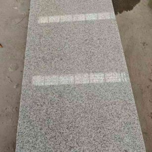 马鞍山芝麻白光面毛板